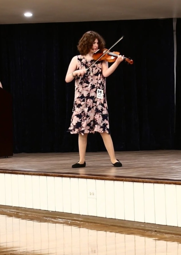 Participant performing their talent on stage